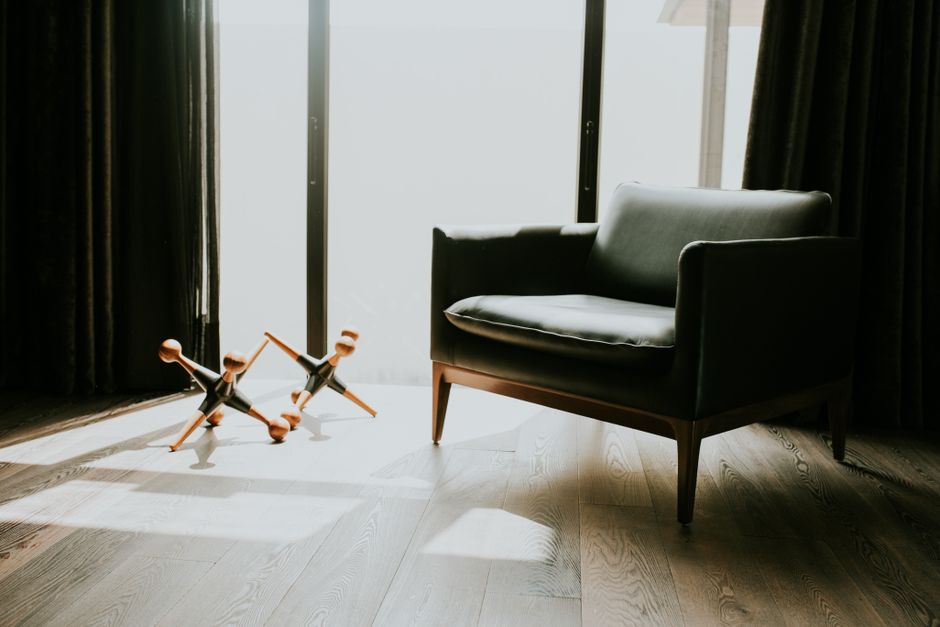 The bright, sunlit interior of a modern home with minimalist design and clean lines, showcasing an aspirational and successful real estate outcome.